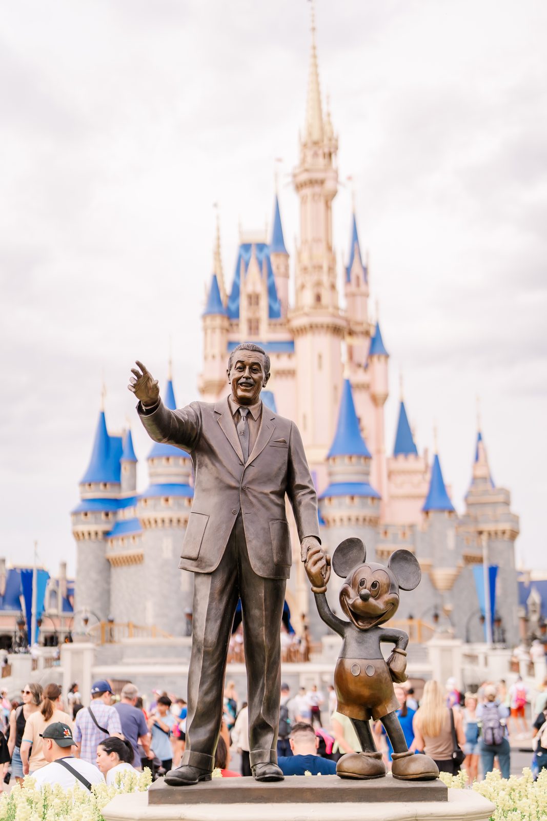 Walt & Mickey Partners statue in front of Cinderella Castle